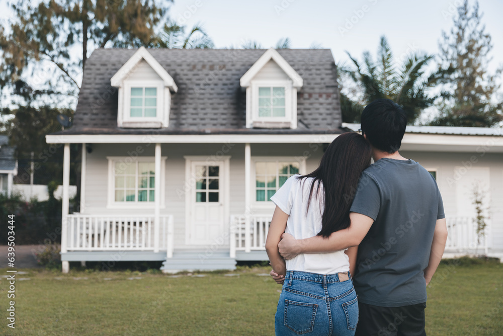 Asian love couple standing outside the new tiny house in countryside Asian love couple standing outside the new tiny house in countryside