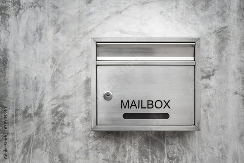 Photography A luxury design stainless mailbox or postbox which is installed on concrete wall