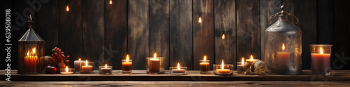 Banner image of Candle with bible on a old oak wooden table. Beautiful gold background. Religion concept.