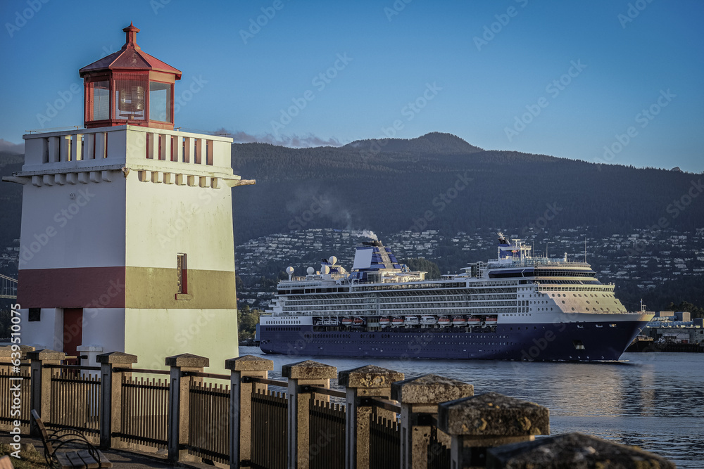 Luxury cruiseship cruise ship liner Summit arrival sail into port of Vancouver, BC Canada from Alaska Last Frontier adventure cruising during sunrise with beautiful scenic view