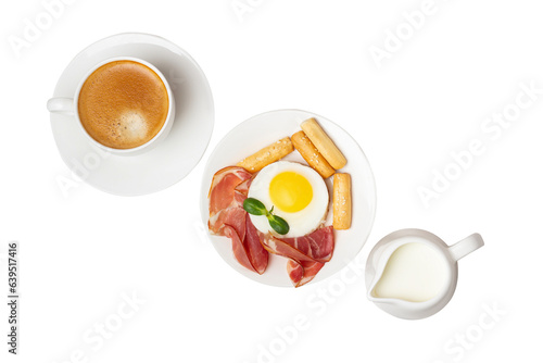 a cup of coffee, scrambled eggs with bacon and a milk jug on an isolated background
