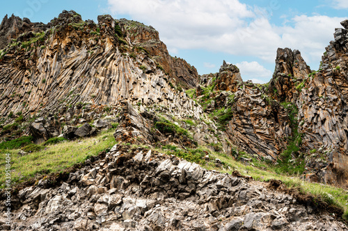 unusual rock formation, breed. Mountains, geology, trekking and beautiful forms views and backgrounds in nature. Panorama mountain summer landscape, blue sky with white clouds. photo