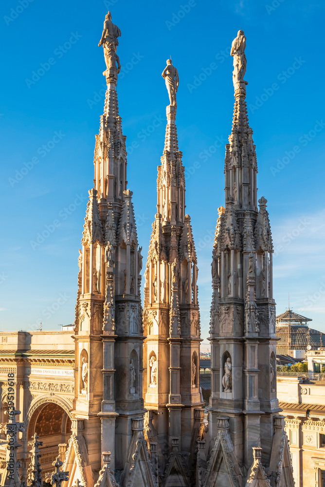 The spires and pinnacle sculptures on the roof of the Milan Cathedral