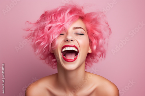 Portrait of laughing woman with pink hair