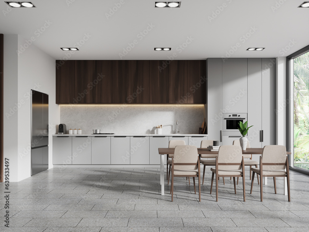 Fototapeta premium White, gray and wooden kitchen interior with table