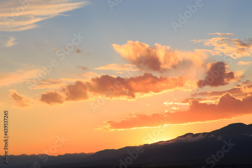 Pink vanilla heaven. Bright blue sky with gentle cumulus clouds.