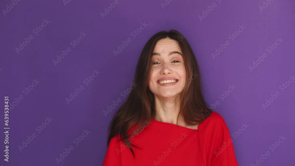 Smiling happy young brunette girl wears red sweater scream hot news about sales discount with hands near mouth isolated on purple background. Lifestyle emotions, announce. Attention! Smiling happy young brunette girl wears red sweater scream hot news about sales discount with hands near mouth isolated on purple background. Lifestyle emotions, announce. Attention!