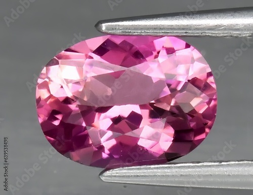 Natural gem pink tourmaline on gray background
