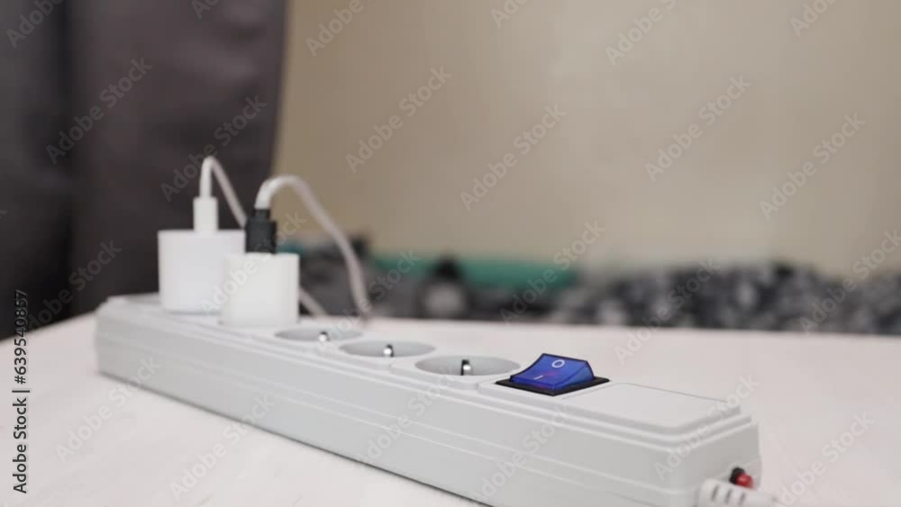 power off, turning off electrical appliances on many sockets, the hand presses the button off