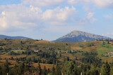 Landscapes of the Carpathian mountains and settlements. Travel concept. Hills, mountains, sky and clouds