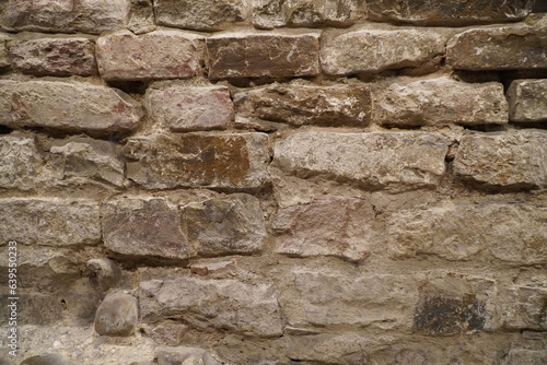 Italian historic site bricks. Brick grunge wall background. Old wall with stained aged bricks.