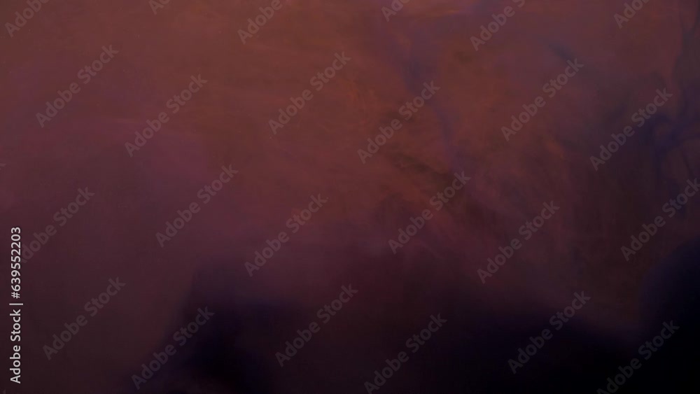Slow motion orange and pink ink acrylic paint mixing in water, swirling softly underwater. Acrylic cloud paint in aquarium. Slowmotion abstract smoke explosion animation. Beautiful art background Slow motion orange and pink ink acrylic paint mixing in water, swirling softly underwater. Acrylic cloud paint in aquarium. Slowmotion abstract smoke explosion animation. Beautiful art background