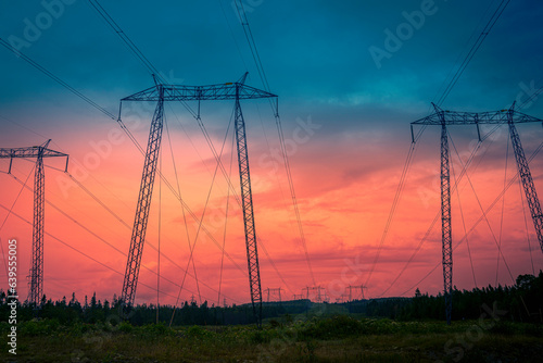 Electricity pylons and cables against the stormy sunset sky on TransCanada Highway on Route 1 in St John, New Brunswick, Canada, abstract artificial shapes and geometry in nature photo