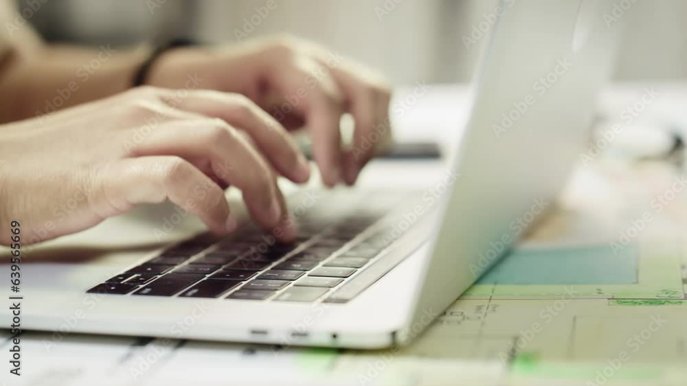Close up shot of the Hands of a person typing on a Notebook keyboard or Busy texting or emailing using a Laptop Close up shot of the Hands of a person typing on a Notebook keyboard or Busy texting or emailing using a Laptop