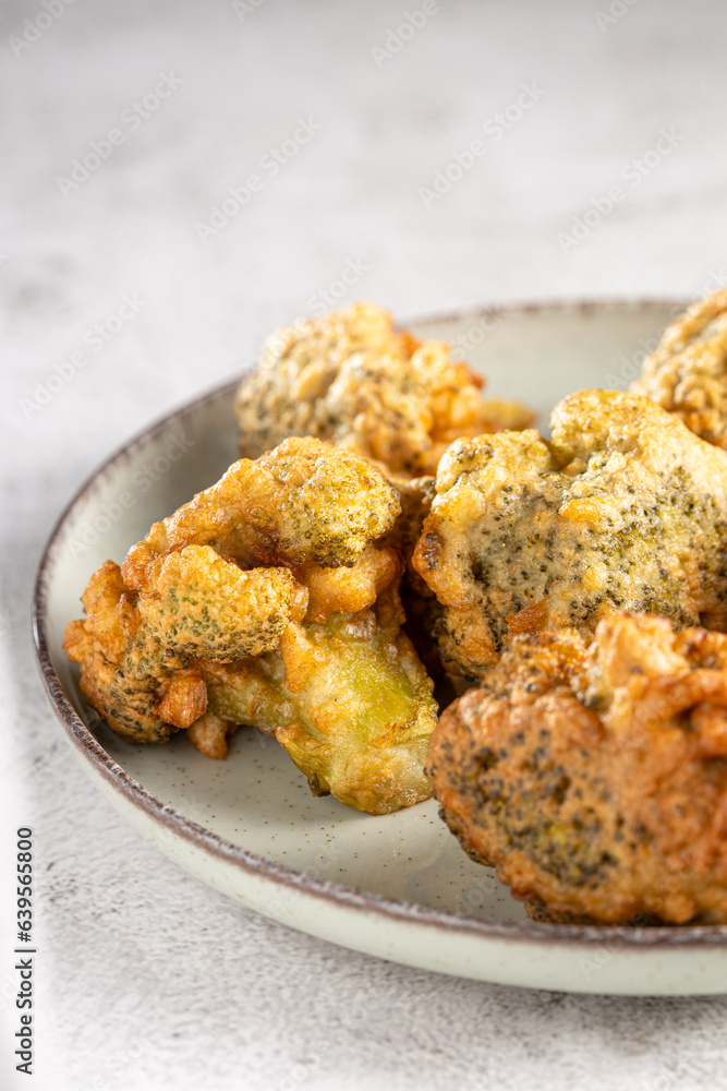 Fried breaded broccoli on the table. Fried breaded broccoli on the table.