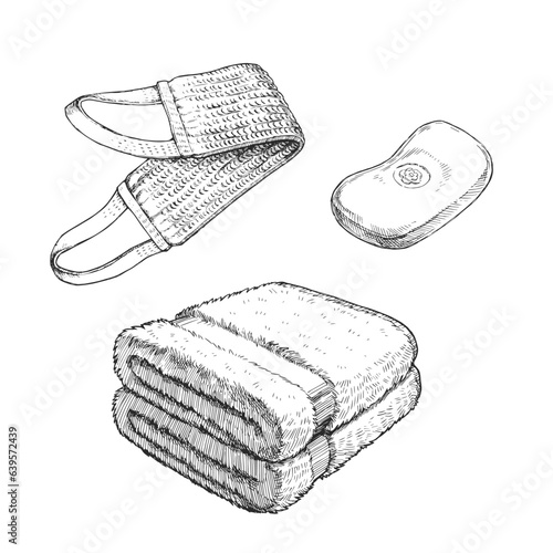 Vector set of hand-drawn illustrations of bath accessories isolated on white. Sketch of soap, loofah and towels in engraving style.