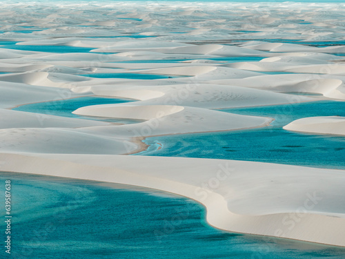 Aerial view of Lencois Maranhenses. White sand dunes with pools of fresh and transparent water. Desert. Barreirinhas. Maranhao State National Park. Brazil © Naeblys