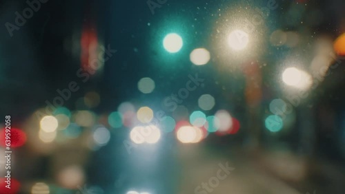 View from the front window of the car on the city at night with lights from the headlights of cars and city lights in blur.Car Driving Highway Many Lights Cars Overtaking Other Vehicles Night City 