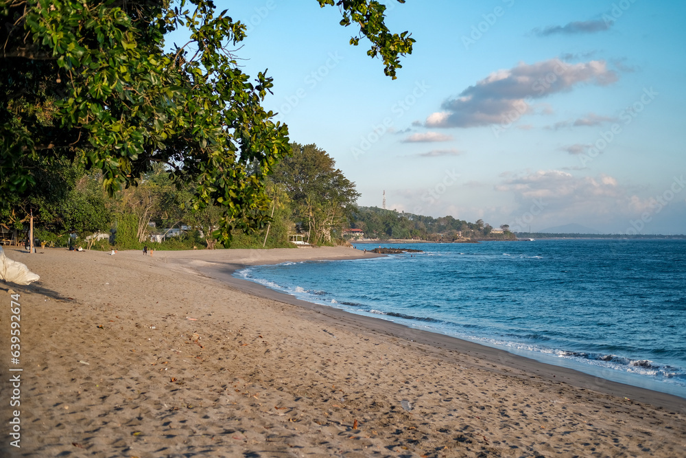 sunset view on senggigi beach lombok, beach and mountain landscape, sunset on the sea, waves on the sea, sea and sky, sunset on the beach, beach in summer