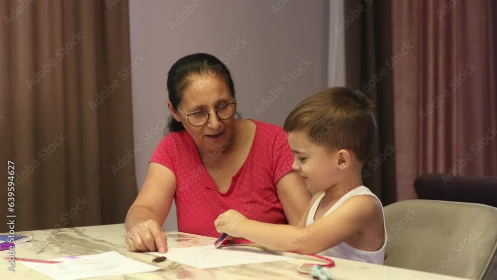 Grandmother with grandson having fun at home talking jokes. Grandmother with grandson having fun at home talking jokes.