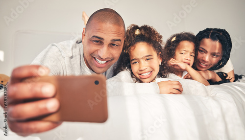 Home, bed and father take selfie of happy family in morning for social media, memory and love. African woman, man and kids lying on bedroom for profile picture, vacation and relax on fun holiday