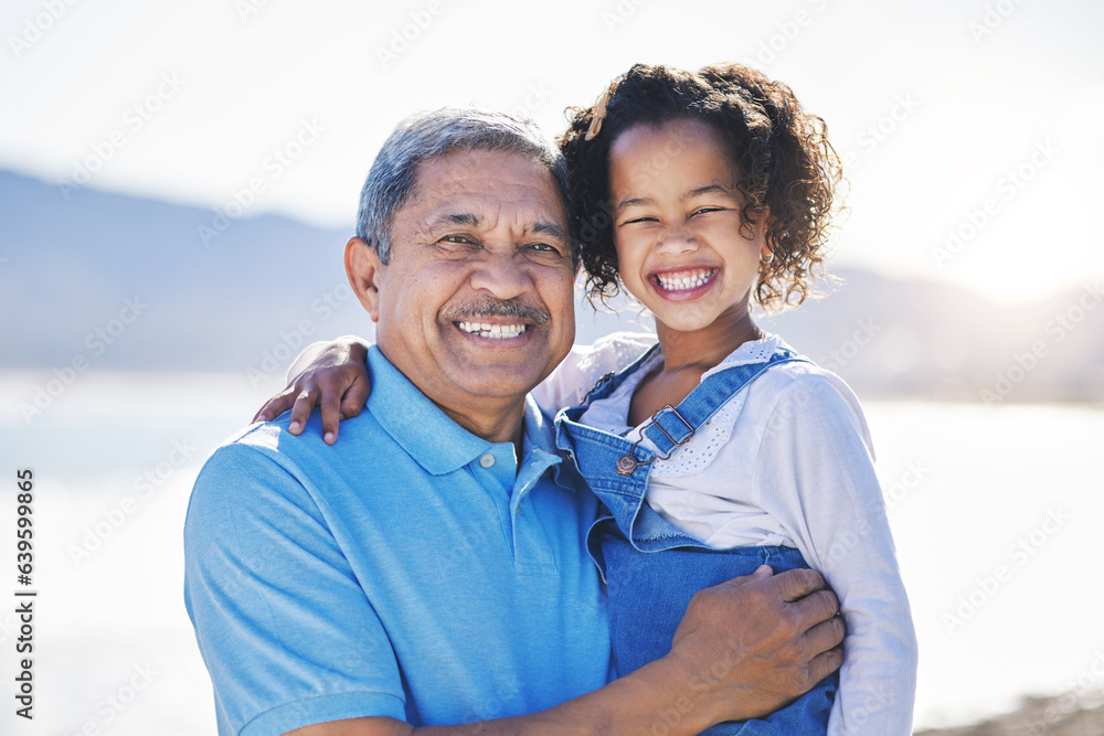 Obraz premium Happy, beach and portrait of child with grandfather on a vacation as travel together on outdoor holiday for happiness. Hug, smile and grandparent with kid or grandchild by ocean or sea for adventure