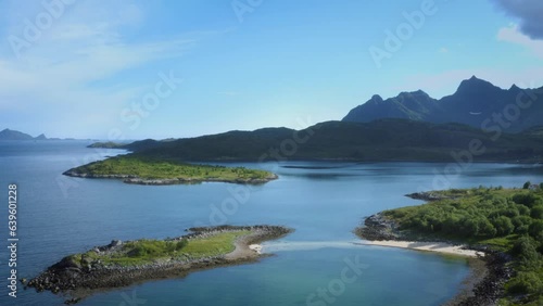 Drone rising above a beautiful surreal looking river with mountains in the background photo