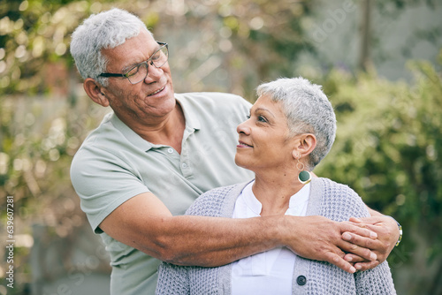 Hug, love and senior couple in a garden with care, trust and support, conversation and bond outdoor. Happy, marriage and elderly man with old woman in backyard embracing retirement, relax and smile