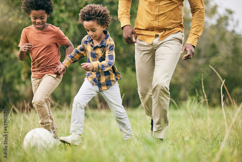 Photos Family, ball and a boy playing soccer on a field outdoor for fun together with his happy brother