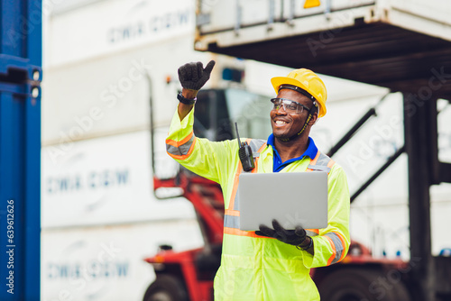 Tableau sur toile African male dock worker control loading containers cargo at warehouse container shipyard
