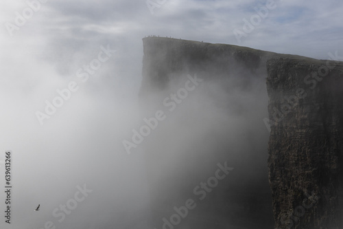 Slave cliff in the mist, Traelanipa, Vagar, Faroe Islands  photo