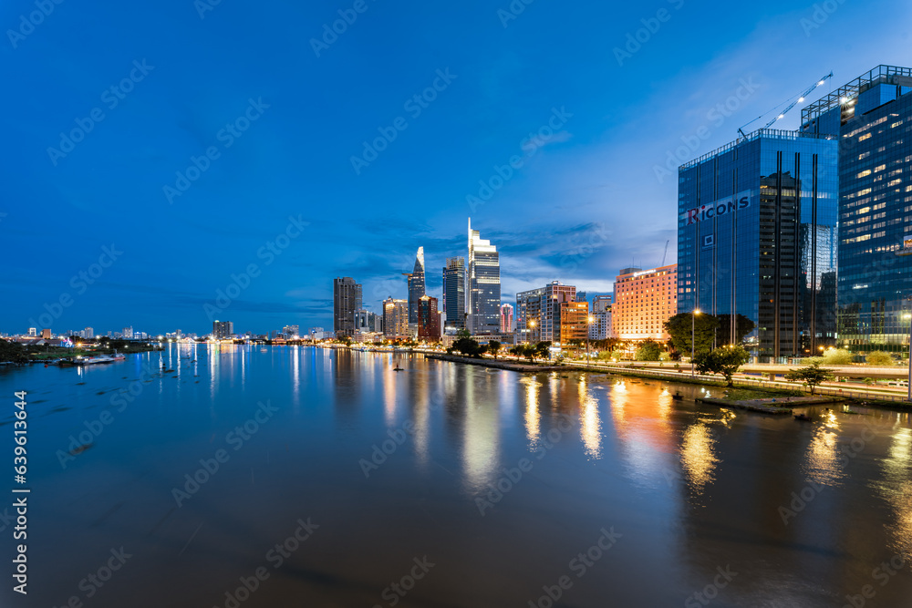 Aerial view of Bitexco Financial Tower building, Century Link, train tracks, buildings, roads, and Saigon river Aerial view of Bitexco Financial Tower building, Century Link, train tracks, buildings, roads, and Saigon river