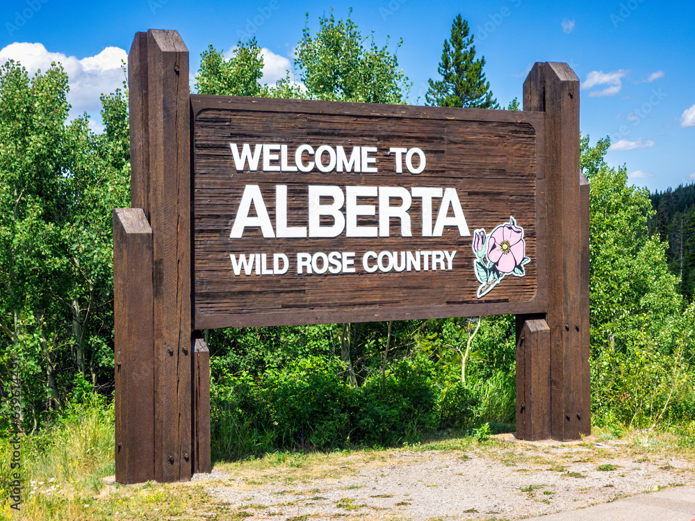 Welcome to Alberta sign near the border crossing between Waterton National Park, Canada and Glacier National Park, USA.