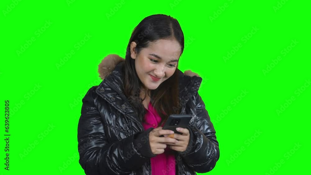 Happy overweight woman smiling while chatting on mobile phone Happy overweight woman smiling while chatting on mobile phone