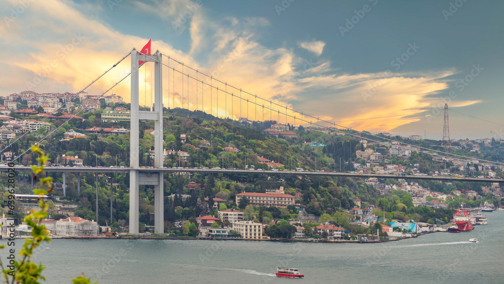 Fototapeta premium Aerial sunrise shot of Istanbul city from Fethi Pasha Grove overlooking Bosphorus strait, with Bosphorus Bridge, or Bogazici Koprusu, connecting Europe and Asia, Istanbul, Turkey