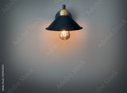 Retro sconce with a light bulb under the shade,