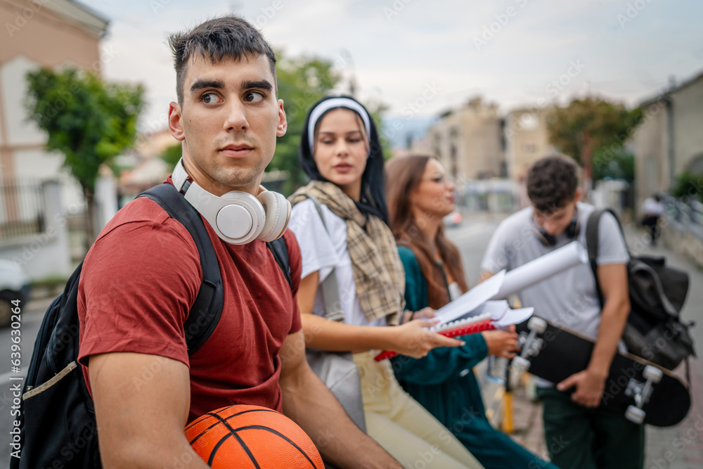 group of teenage students gen z sit in front of school university