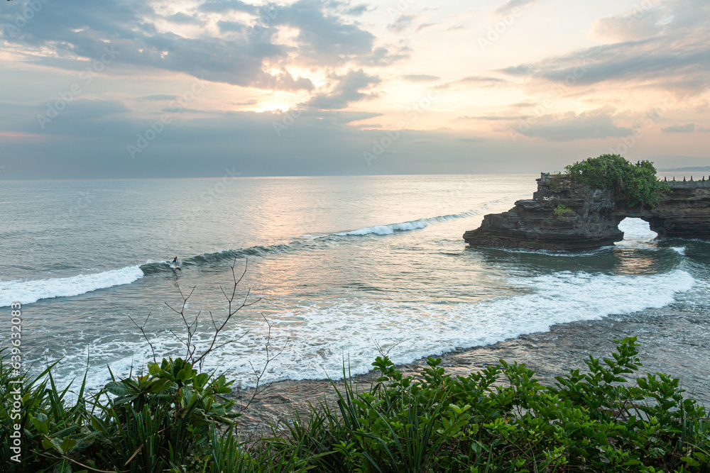 Sunset surf at Tanah Lot temple, Bali, indonesia