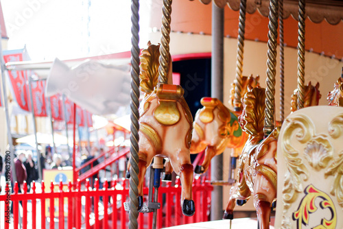 Merry-go-round horses at a theme park photo