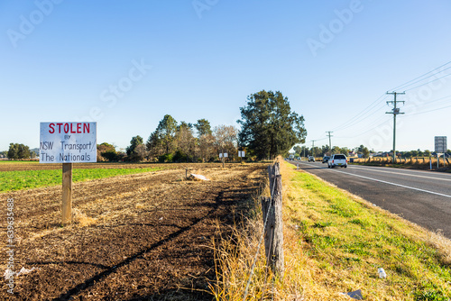 Sign protesting forced land acquisition for Singleton Bypass photo