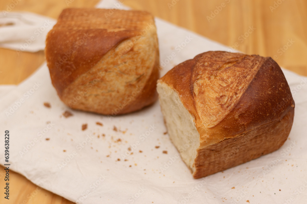 Homemade bread on a white tote bag background, two pieces of bread 