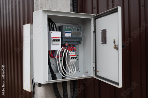 Neat fuse box with electric meter on a pylon