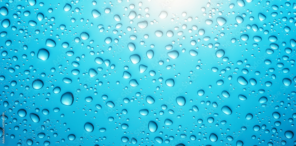 drops falling on a transparent glass drops falling on a transparent glass