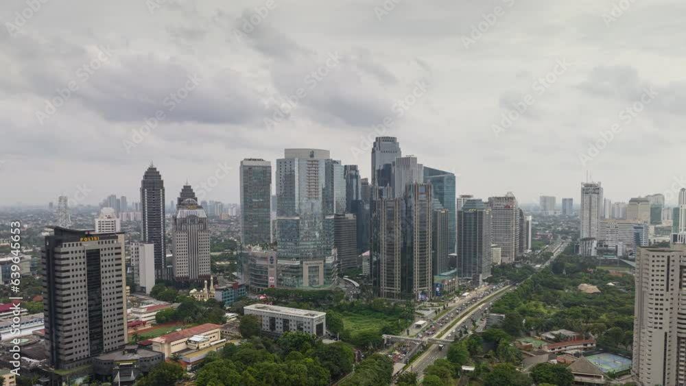 sunny day jakarta city downtown flight over famous traffic street interchange aerial panorama 4k timelapse indonesia sunny day jakarta city downtown flight over famous traffic street interchange aerial panorama 4k timelapse indonesia