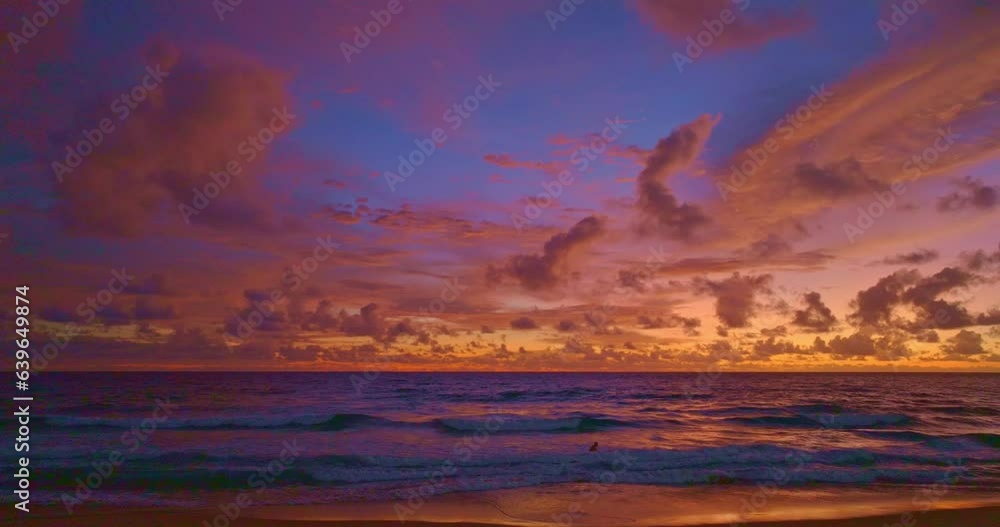 .aerial view smooth waves in colorful sky in sunset at Karon beach Phuket..scenery clouds in sweet sky at sunset above the ocean..amazing sky of bright sunset in nature and travel concept.. .aerial view smooth waves in colorful sky in sunset at Karon beach Phuket..scenery clouds in sweet sky at sunset above the ocean..amazing sky of bright sunset in nature and travel concept..
