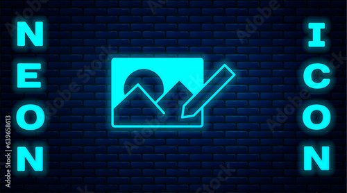 Glowing neon Photo retouching icon isolated on brick wall background. Photographer, photography, retouch icon. Vector