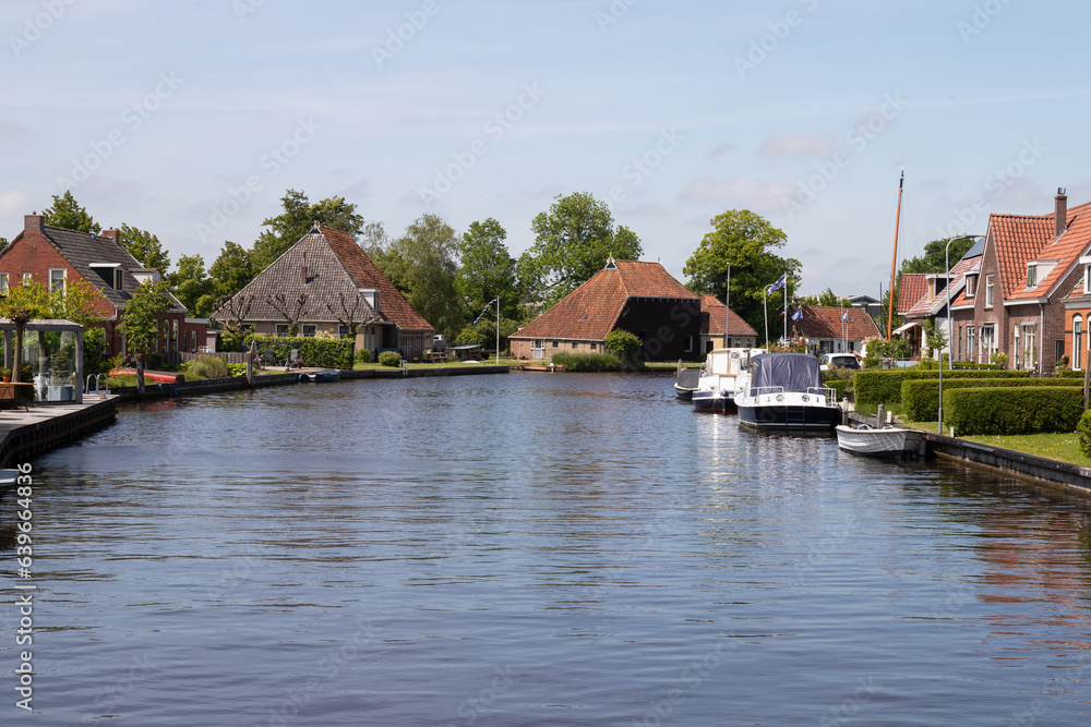 View of the picturesque Dutch village of Terherne located near lakes in Friesland.