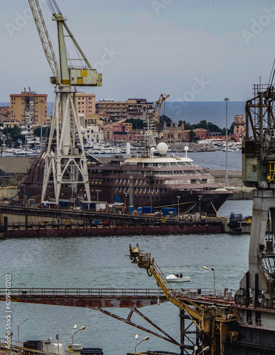 Italian shipbuilder dry dock ship building facilities in Palermo, Sicily Italy with massive construction cranes and docks and luxury cruiseship cruise ship liner maintenance modernisation overhaul ren photo