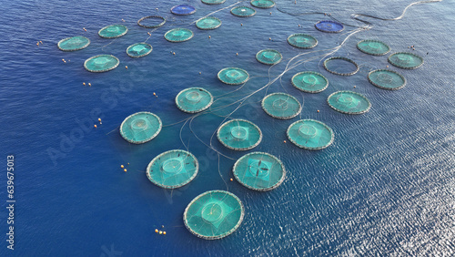 Aerial drone photo of latest technology fish farm breeding cages in fishery unit located in Mediterranean deep blue sea