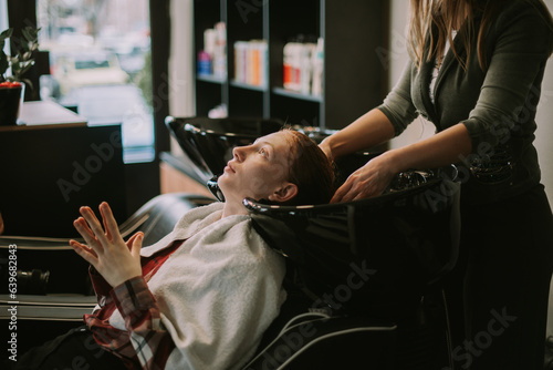 Washing hair with waterat the salon photo